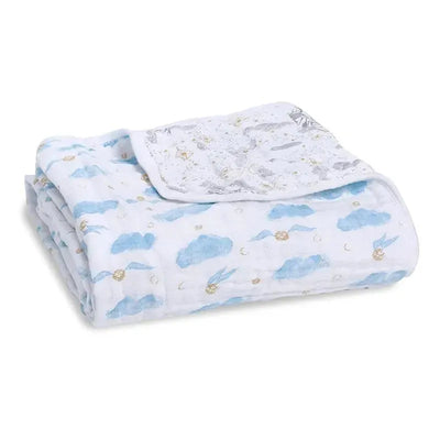 Quilt featuring blue clouds and golden snitches, part of the Aden + Anais Harry Potter collection.