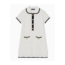 White collared dress for girls by Armani, featuring a ribbed texture, black trim, gold buttons, and front pockets.