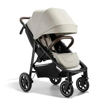 Lightweight Baby Jogger City Mini Air stroller with a beige canopy, padded seat, and compact fold.