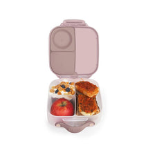 Mini lunch box in Blush Crush color, featuring compartments with an apple, yogurt with granola and berries, and bread with topping.