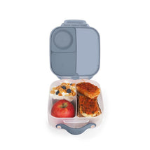Mini lunch box by b.box featuring two compartments with yogurt, granola, apple, and sandwich.
