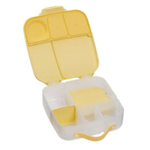 Oversized yellow lunch box for kids, featuring multiple compartments for food organization.