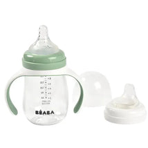 Beaba 2-In-1 bottle to sippy training cup in sage color, featuring two handles and interchangeable cap with a nipple.