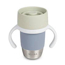 Beaba Stainless Steel 360 Learning Cup in Pebble color with a gray body, white handles, and a green lid.