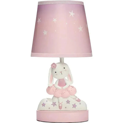 Tiny Dancer lamp featuring a cute bunny in a pink tutu, with a pink star-patterned shade.