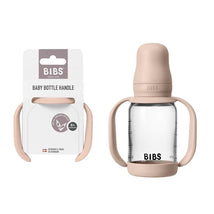 Baby bottle handle in blush color with a clear bottle, designed for infants 6+ months, featuring grips for easy handling.