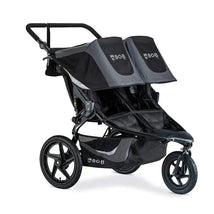 Double BOB jogging stroller in black with two seats, adjustable canopies, and sturdy wheels for outdoor use.
