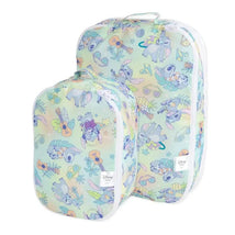 Packing cubes featuring a pastel Aloha design with Stitch from Disney, ideal for organizing travel items.