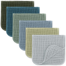 Muslin burp cloths in various colors including green, blue, and gray, featuring a soft, quilted texture.