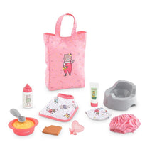 Large pink accessory set for Corolle dolls includes a bear-printed bag, feeding bowl, bottle, wipes, and other play items.