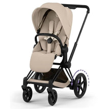 Cybex E-Priam stroller featuring a matte black frame and cozy beige lux seat, with visible wheels and spacious storage below.