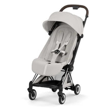 Cybex Platinum Coya stroller in City Grey lux seat with chrome frame, featuring a compact fold and adjustable canopy.