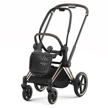 Cybex Priam4 stroller frame in rose gold and brown, featuring a sleek design with four wheels and adjustable handle.