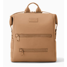 Camel medium diaper backpack by Dagne Dover with two front zip pockets and a structured design.