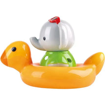 Colorful toy featuring an elephant wearing a red hat, riding on an orange inflatable duck.