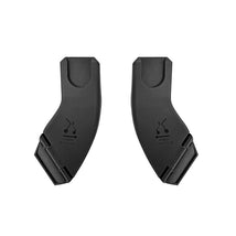 Black car seat adapter for Inglesina Quid³ stroller, featuring clear travel direction markings and a sleek design.
