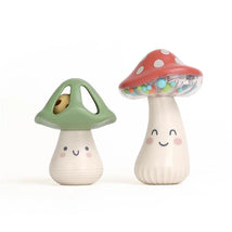 Mini maracas shaped like smiling mushrooms, one in green and one with a red cap, filled with colorful beads.