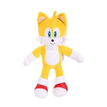 Plush toy of Tails from Sonic the Hedgehog, featuring yellow fur, blue eyes, and red shoes.