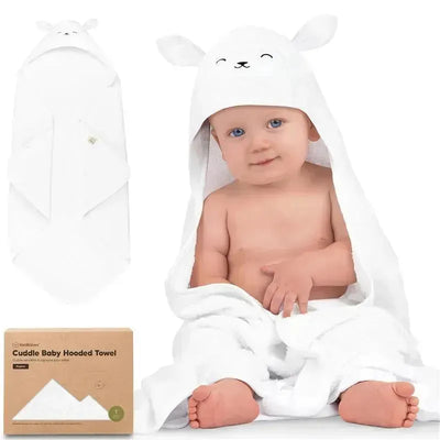 Hooded baby towel in lamb design with a smiling baby sitting wrapped in it, showcasing softness and cuteness.