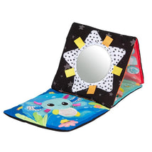 Activity mat featuring colorful marine-themed designs, a star-shaped mirror, and tactile elements for infant sensory play.