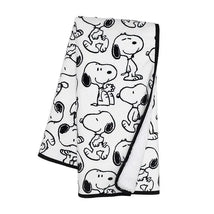 Lambs & Ivy Classic Snoopy Blanket features a white fabric with black Snoopy character patterns, ideal for cozying up.