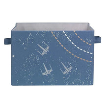 Collapsible storage bin in a galaxy theme, featuring blue fabric with star and spaceship designs.