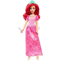 Disney Princess Ariel doll featuring red hair, a pink dress with star designs, and a tiara, holding a fork.