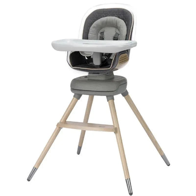 Maxi-Cosi Kiskadee 360 Rotating Highchair from the Kindred Collection in Onyx Heritage, featuring a gray seating area and wooden legs.