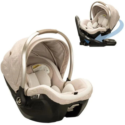 Maxi-Cosi Peri 180° Rotating Infant Car Seat in Natural Heritage color, featuring a quilted canopy and cushioned interior.