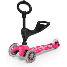 Pink Micro Kickboard - Mini 3in1 Deluxe scooter with a black handle, featuring three wheels and a footrest.