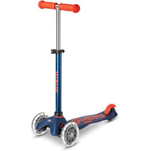 Navy blue Micro Kickboard Mini Deluxe LED Scooter with orange handlebars and clear wheels. Ideal for young riders.