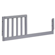 Grey toddler bed conversion kit with slats, designed for transitioning a mini crib to a toddler bed.