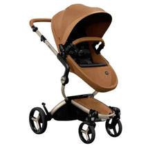 Mima Xari MAX stroller in champagne, black, and camel colors, featuring a spacious seat and large wheels for easy maneuverability.