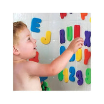Child playing with colorful Munchkin Learn Bath Letters & Numbers on a wet wall, exploring letters and numbers during bath time.