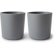 Mushie Silicone Dinnerware Cup Set in Smoke, featuring two matching gray cups with a smooth finish.