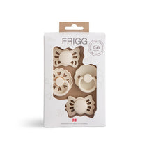 Four pacifiers in a decorative box, featuring floral and heart designs, suitable for babies 0-6 months.