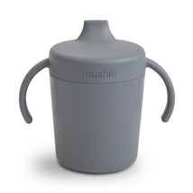 Trainer sippy cup in smoke color with a spill-proof lid and two handles, designed for toddlers.