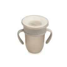 Nouka All Around Cup in Soft Sand color features two handles and a spill-proof lid, ideal for young children.