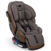 Nuna EXEC™ next All-in-One Car Seat in granite gray, featuring a padded seat, adjustable harness, and safety labels.