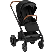 Nuna MIXX™ next stroller in caviar, featuring a spacious seat, magnetic buckle, and brown leatherette handlebar.