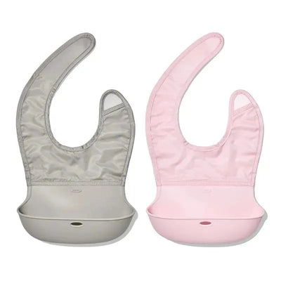 Two silicone roll-up bibs in grey and pink, designed to catch spills during mealtime for children.