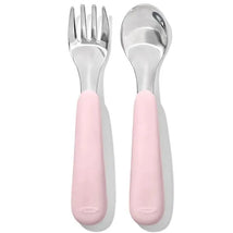 OXO Tot Fork and Spoon Set in Blossom, featuring a pink grip with stainless steel utensils, designed for toddlers.