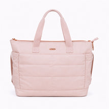 Pink Primo Passi diaper bag with dual handles and a zip closure, featuring a quilted texture and gold accents.