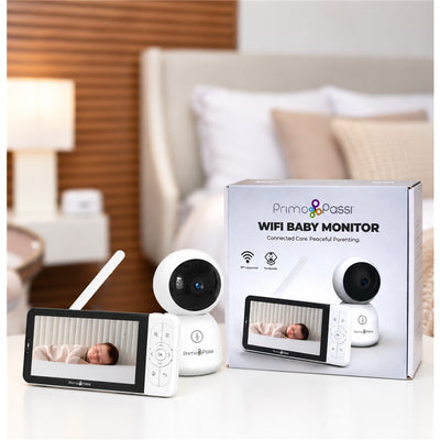 Smart Wi-Fi baby monitor with 5” HD screen displaying a sleeping baby, alongside the camera and packaging.
