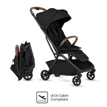 Compact travel stroller in Onyx Black with a foldable design and IATA cabin compliance emblem.