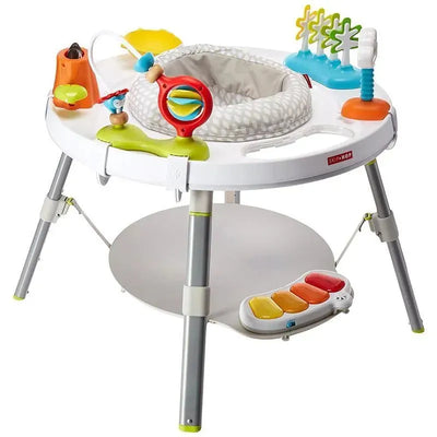 3-stage activity center for babies featuring a padded seat, colorful toys, and a piano keyboard at the base.