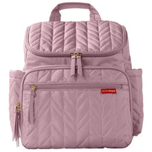 Quilted mauve diaper backpack by Skip Hop featuring multiple zippered pockets and a top handle for easy carrying.