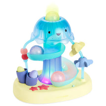 Colorful seascape-themed musical activity toy with a jellyfish design, balls, and interactive features for infants.