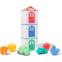 Colorful stacking toy houses labeled A, B, C, with various small animal figurines and a ball beside them.