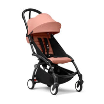Stokke Yoyo³ Stroller in ginger color, featuring a padded seat, versatile canopy, and a compact fold design.